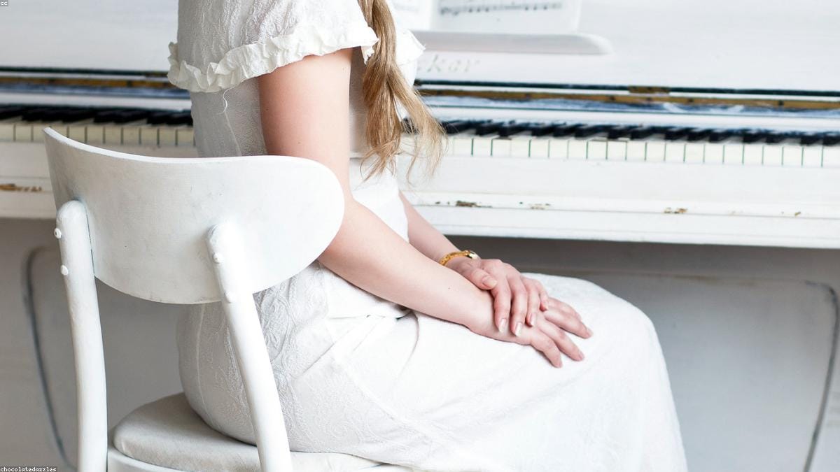 A beginner practising finger exercises on the piano